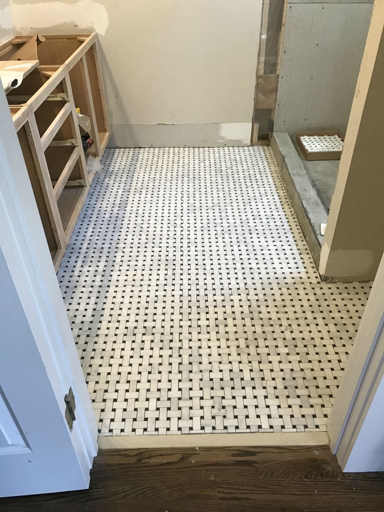 Bathroom floor tiles installed but not grouted. - 2 Apr 2017