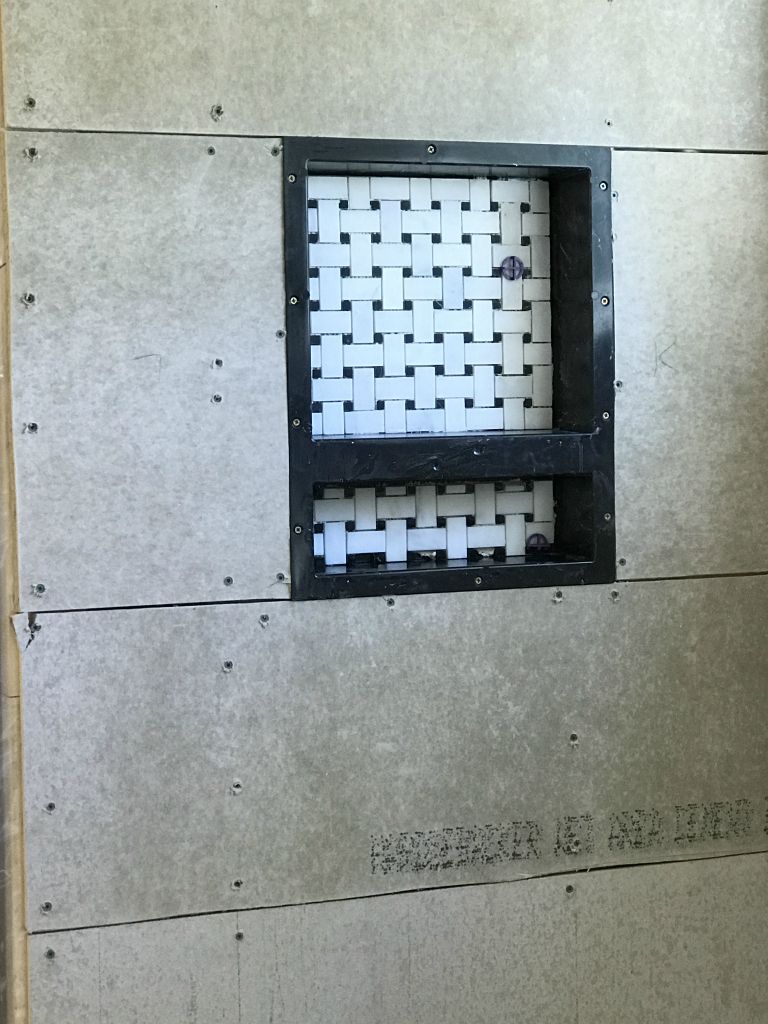 We have also tiled the inside of the niche.