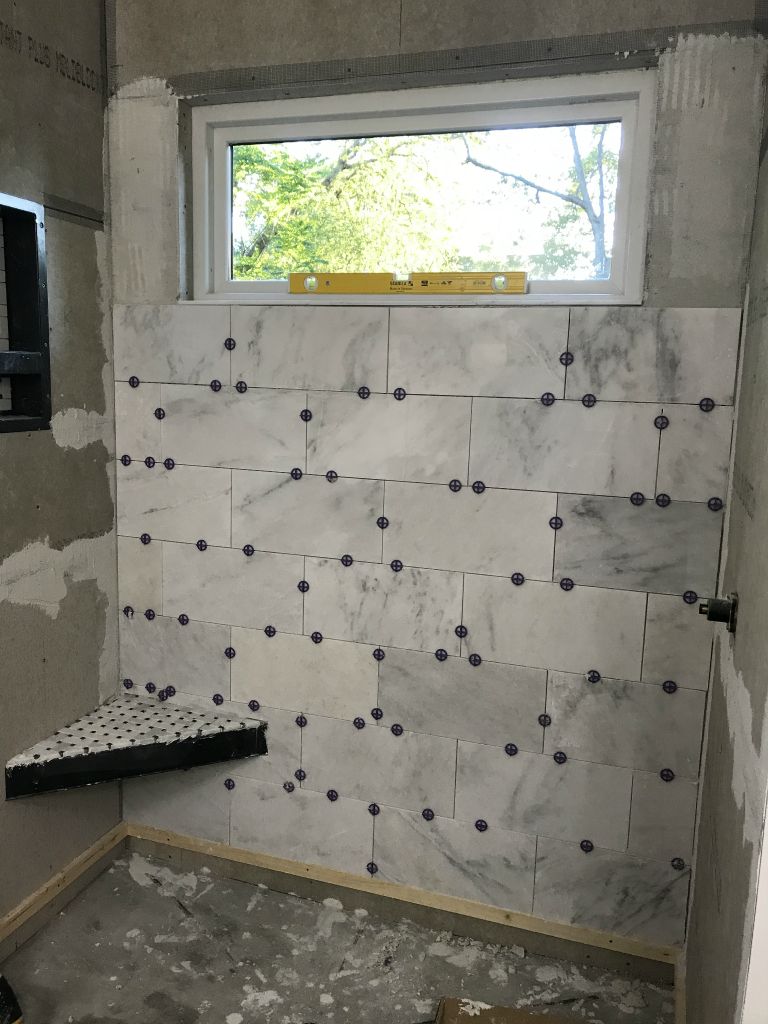 Wall tiles start to go on