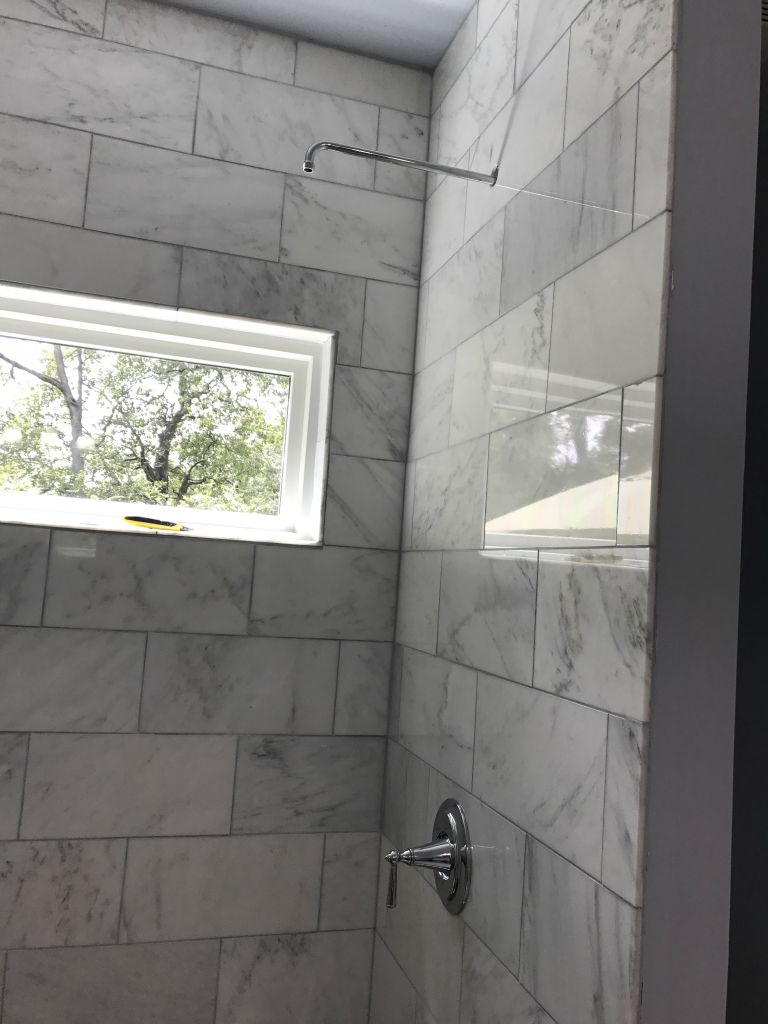 Shower head arm and valve handle installed