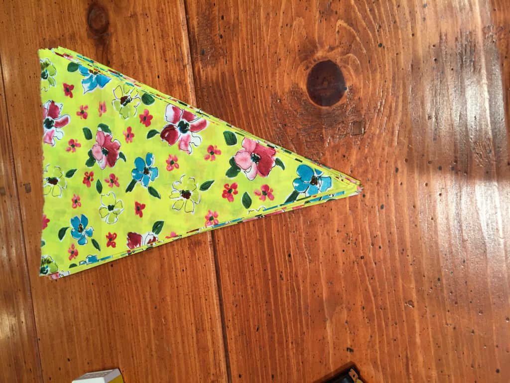 I start working on the bunting for the wedding welcome dinner.  Only a couple hundred more to go.  - 14 Nov 2015