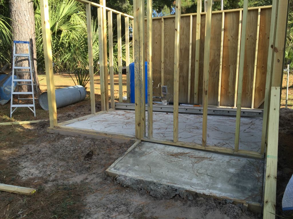 We've had Ron put in a concrete floor and the walls start to go up.