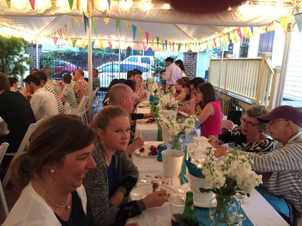 Family and freinds enjoying the sausage and crawfish starters