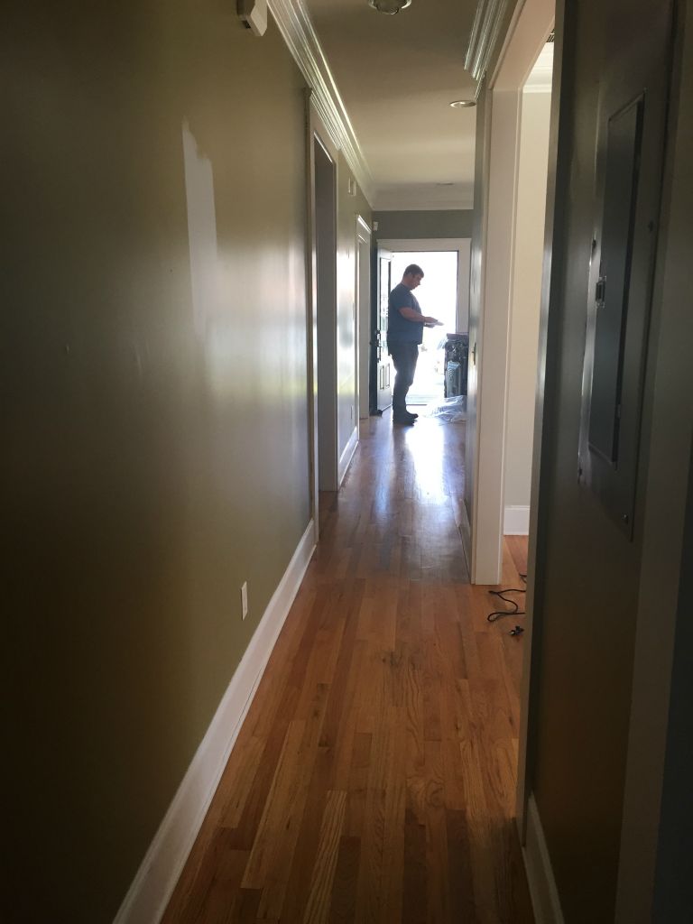 Hallway, looking towards the front door from the master bedroom doorway.