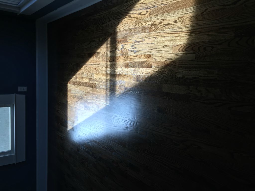 New floor in master bedroom, looking beautiful in the sunshine.