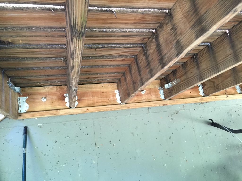 We attach th back deck joists to the house - as advised by the home inspection before we bought the house